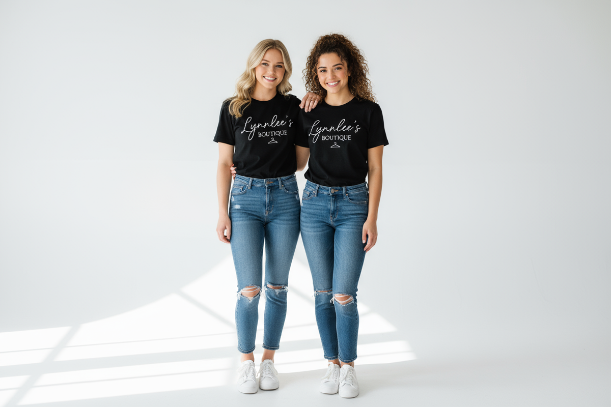 Two white girls wearing black shirts that say lynnlee’s boutique
